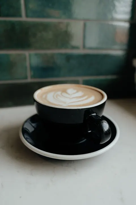 Birdie's baristas preparing drinks together behind the counter.